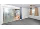 Finished basement featuring painted brick walls, carpet flooring, and access to the upper floors at 6017 E 52Nd Pl, Indianapolis, IN 46226