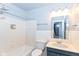The updated bathroom features a shower-tub combo and modern vanity for convenience at 6017 E 52Nd Pl, Indianapolis, IN 46226