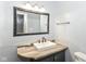Updated bathroom features a stylish mirror, modern vanity, and fixtures at 6017 E 52Nd Pl, Indianapolis, IN 46226