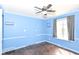 Bedroom features hardwood floors, base-board heating, and a window allowing for natural light at 6017 E 52Nd Pl, Indianapolis, IN 46226