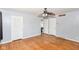 This bedroom boasts hardwood floors, neutral walls, and multiple entryways for convenience and accessibility at 6017 E 52Nd Pl, Indianapolis, IN 46226