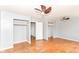 Spacious bedroom with hardwood floors, closet space, and open doorways for easy access at 6017 E 52Nd Pl, Indianapolis, IN 46226