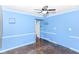 Bedroom features hardwood floors, base-board heating, and an open doorway at 6017 E 52Nd Pl, Indianapolis, IN 46226