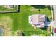 Expansive backyard with lush lawn and patio, perfect for outdoor relaxation and entertaining, complemented by mature trees at 621 Sonoma Ln, Greenfield, IN 46140