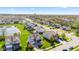 Suburban neighborhood featuring well-maintained homes, lush green lawns, mature trees, and a picturesque pond at 621 Sonoma Ln, Greenfield, IN 46140