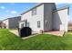 Grill and outdoor seating on the backyard patio, perfect for entertaining guests at 621 Sonoma Ln, Greenfield, IN 46140