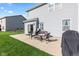 Backyard patio with comfortable outdoor seating and grill for relaxing and dining outdoors at 621 Sonoma Ln, Greenfield, IN 46140
