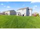 Lush backyard with patio, grill, and lawn, perfect for outdoor gatherings and recreation at 621 Sonoma Ln, Greenfield, IN 46140