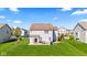 Spacious backyard featuring a well-maintained lawn and patio area, perfect for outdoor activities and relaxation at 621 Sonoma Ln, Greenfield, IN 46140