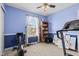 Bedroom features a window, exercise equipment, and a bookcase at 621 Sonoma Ln, Greenfield, IN 46140
