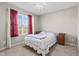 Bright bedroom featuring a window with red curtains and a comfortable bed at 621 Sonoma Ln, Greenfield, IN 46140