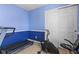 Spare bedroom features a treadmill, stationary bike, and mirrored closet doors at 621 Sonoma Ln, Greenfield, IN 46140