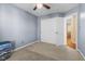 This cozy bedroom features neutral walls, a closet, and a ceiling fan at 621 Sonoma Ln, Greenfield, IN 46140