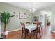 Cozy dining room featuring hardwood floors, table, decor, and natural light at 621 Sonoma Ln, Greenfield, IN 46140