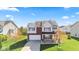 Beautiful two-story home with a well-kept lawn, mature trees, and inviting front porch at 621 Sonoma Ln, Greenfield, IN 46140