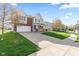 Beautifully landscaped home with a long driveway and attached two-car garage at 621 Sonoma Ln, Greenfield, IN 46140