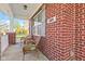 Cozy front porch with wicker chairs and decorative pillows for relaxed outdoor seating at 621 Sonoma Ln, Greenfield, IN 46140