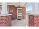 Charming front porch with brick columns, a ceiling light, and a welcoming entryway at 621 Sonoma Ln, Greenfield, IN 46140