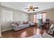 Cozy living room featuring hardwood floors, a large window, and a comfortable couch at 621 Sonoma Ln, Greenfield, IN 46140