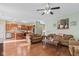 Open concept living room and kitchen with hardwood floors and recessed lighting at 621 Sonoma Ln, Greenfield, IN 46140