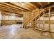 Unfinished basement featuring concrete floors and walls, exposed beams and ductwork, with a framed stairwell at 6408 Askin Dr, Indianapolis, IN 46259