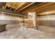 Unfinished basement featuring concrete floors and walls, exposed beams and ductwork, with a framed stairwell at 6408 Askin Dr, Indianapolis, IN 46259