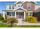 Exterior of the home's entry showing landscaping, brick facade, and entry door at 6408 Askin Dr, Indianapolis, IN 46259