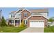Beautiful two-story home with brick and gray siding, an attached two-car garage, and a well-maintained lawn at 6408 Askin Dr, Indianapolis, IN 46259