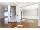 Foyer with beautiful dark wood flooring and an open staircase at 6408 Askin Dr, Indianapolis, IN 46259