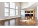 Open-concept living room showcasing high ceilings, large windows, and views into the kitchen at 6408 Askin Dr, Indianapolis, IN 46259