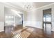Bright living room boasts hardwood floors and detailed wall trim at 6408 Askin Dr, Indianapolis, IN 46259