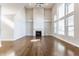 Open living room featuring soaring ceilings, large windows, and a stone fireplace at 6408 Askin Dr, Indianapolis, IN 46259