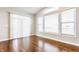 Bright living room with large windows, hardwood floors, and plenty of natural light at 6408 Askin Dr, Indianapolis, IN 46259