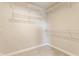 Spacious walk-in closet with carpet floor and many shelves for organization and ample storage space at 6408 Askin Dr, Indianapolis, IN 46259