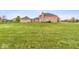 Expansive backyard with a well-maintained lawn and brick home at 6519 Rothchild Blvd, Indianapolis, IN 46278