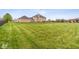 Expansive backyard with green grass provides ample space at 6519 Rothchild Blvd, Indianapolis, IN 46278