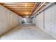 Large unfinished basement with exposed ceiling and concrete floors at 6519 Rothchild Blvd, Indianapolis, IN 46278
