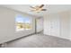 Bright bedroom with neutral paint, plush carpet and a ceiling fan fixture at 6519 Rothchild Blvd, Indianapolis, IN 46278