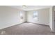 Bedroom with carpet flooring and natural light from two windows at 6519 Rothchild Blvd, Indianapolis, IN 46278