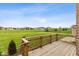 Wooden deck overlooking a vast green lawn and neighboring houses at 6519 Rothchild Blvd, Indianapolis, IN 46278