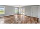 Spacious dining room with hardwood floors and natural light from large windows at 6519 Rothchild Blvd, Indianapolis, IN 46278