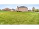 Brick home with a large, well-manicured lawn at 6519 Rothchild Blvd, Indianapolis, IN 46278
