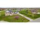 Sprawling brick house sits on a well-manicured lawn with a long driveway at 6519 Rothchild Blvd, Indianapolis, IN 46278