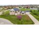 Beautiful brick home features a lush green lawn and mature trees at 6519 Rothchild Blvd, Indianapolis, IN 46278