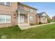 Close up of brick house with white trim and a covered entryway at 6519 Rothchild Blvd, Indianapolis, IN 46278