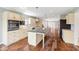 Bright kitchen with a spacious island, hardwood floors, and sleek appliances at 6519 Rothchild Blvd, Indianapolis, IN 46278