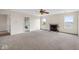Spacious living room featuring a fireplace and carpeted floors at 6519 Rothchild Blvd, Indianapolis, IN 46278