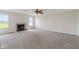 Spacious living room with a fireplace and carpet flooring at 6519 Rothchild Blvd, Indianapolis, IN 46278