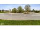 Well maintained street view with fresh landscaping and mature trees in a tranquil suburban neighborhood at 6519 Rothchild Blvd, Indianapolis, IN 46278