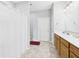 Bathroom view with wood vanity, shower with curtain and a neutral color palette at 6606 Colt Ln, Anderson, IN 46013